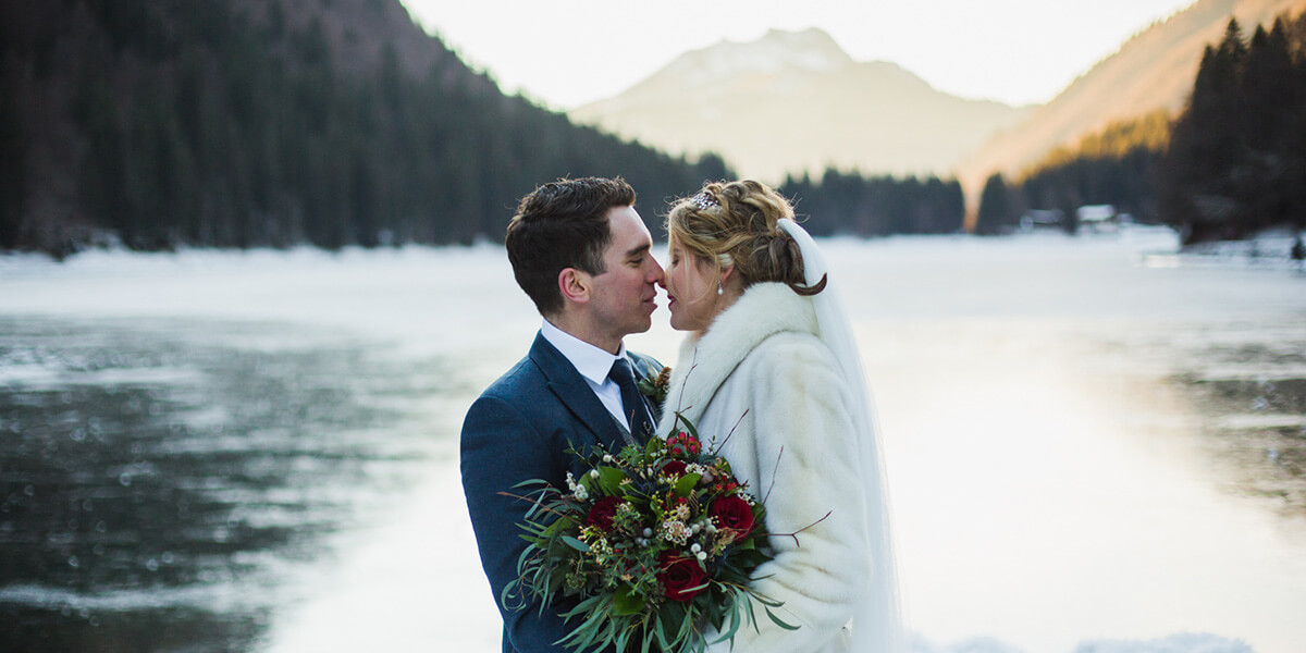 wedding couple kissing at lake montriond near morzine