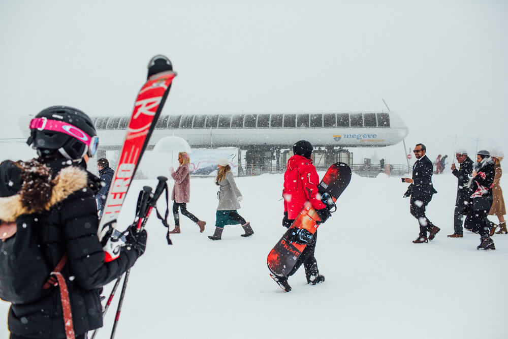 Wedding guests and skiers at the top of Megeve Chairlift