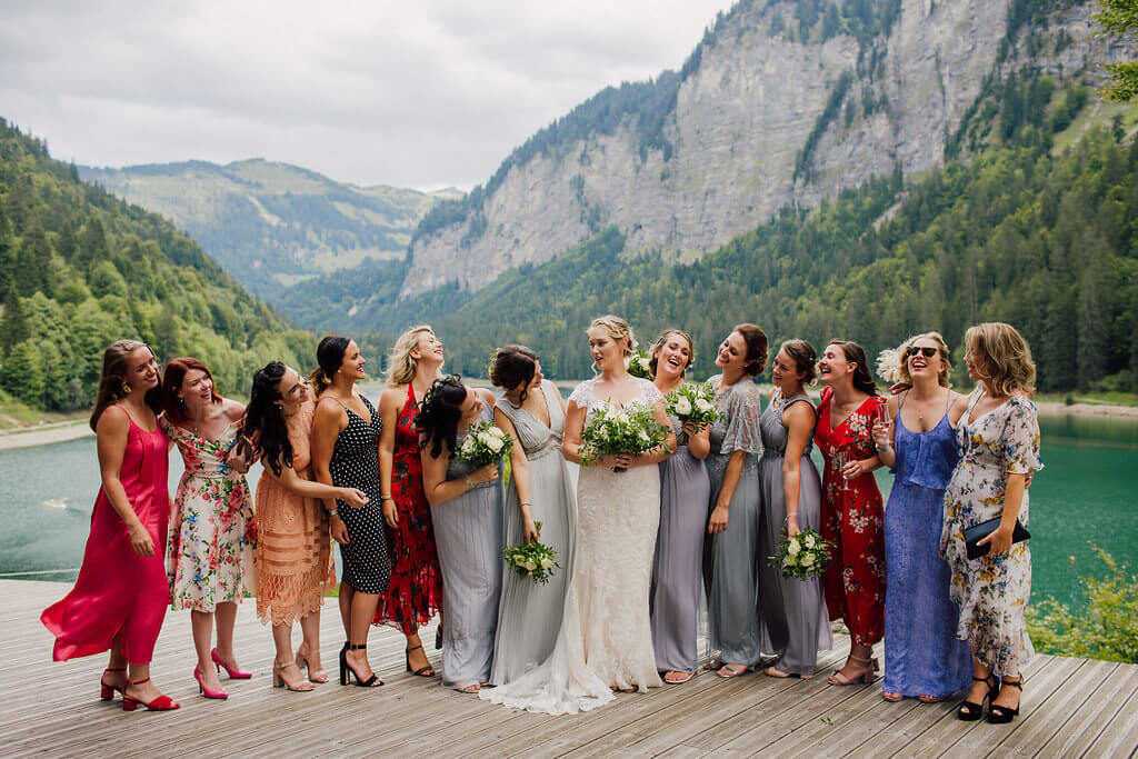 wedding group formal photos with the bridesmaids in a wedding at the alps