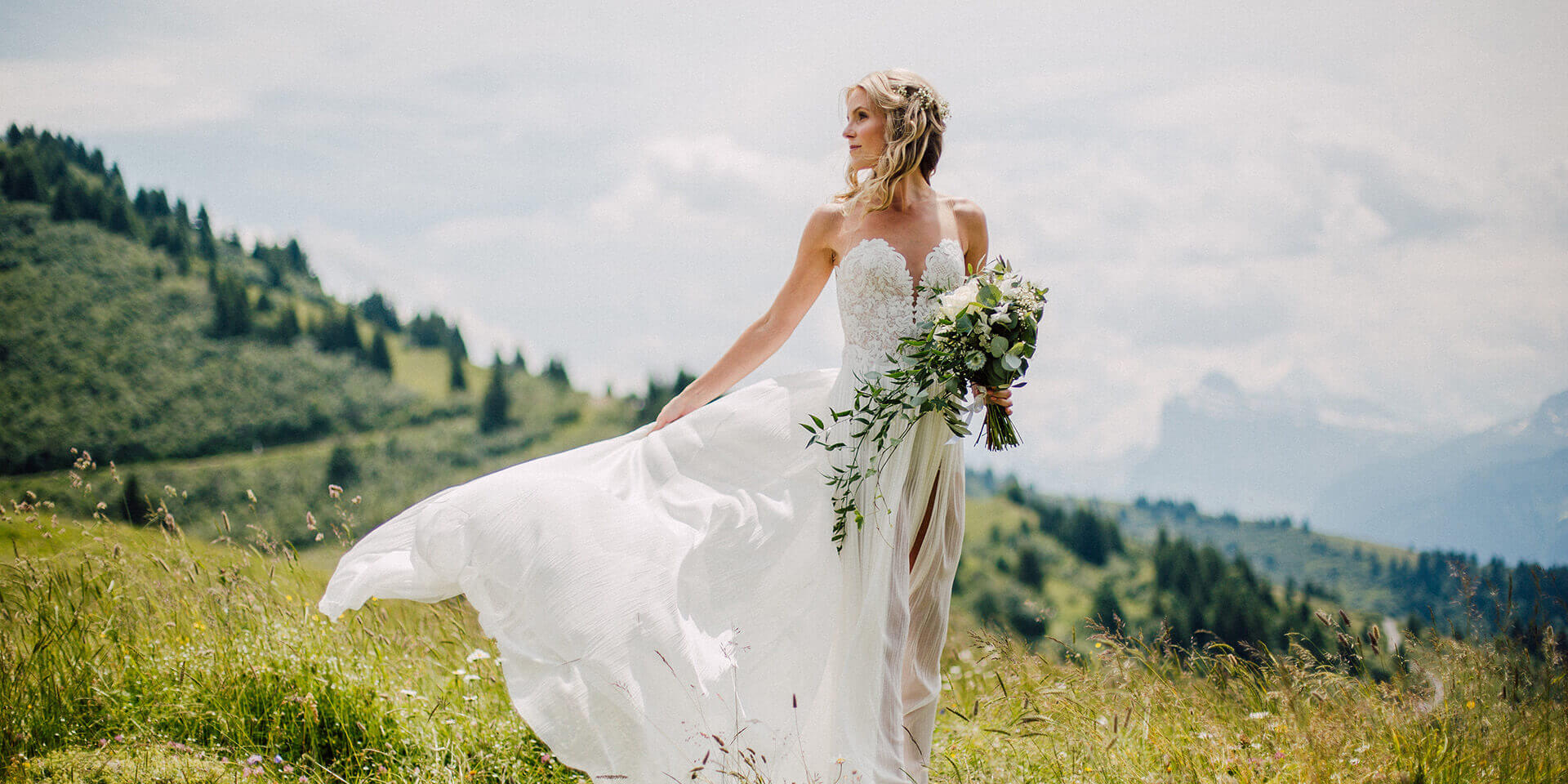 bride on her wedding in morzine with the mountains in the background